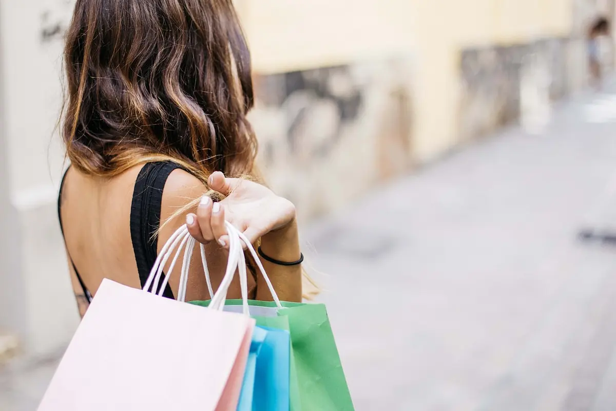 A shopper carrying shopping bags