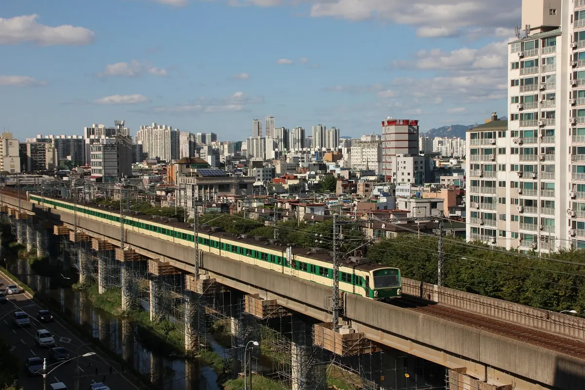A subway train crossing a bridge in Seoul